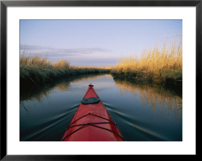 The Bow Of A Kayak Leads The Way Through A Marsh Channel by Skip Brown Pricing Limited Edition Print image