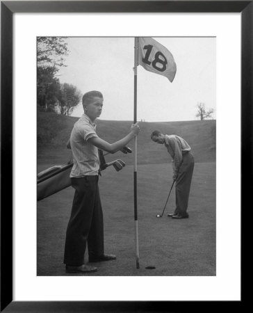 Son Cary Caddying For His Father by Nina Leen Pricing Limited Edition Print image
