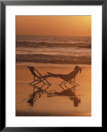 Silhouette Of Woman In Beach Chair On The Beach by Mitch Diamond Pricing Limited Edition Print image