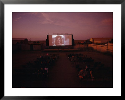 A Walk-In Picture Garden In The Kimberley Town Of Derby, An Audience Watches An Early Evening Film by Sam Abell Pricing Limited Edition Print image
