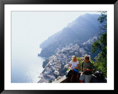 Couple Reading Guidebook On Lookout Above Town, Positano, Italy by Philip & Karen Smith Pricing Limited Edition Print image