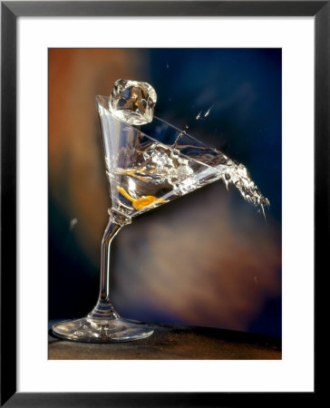 Vodka Martini Spilling From A Bent Martini Glass With Ice Cube by Jeff Sarpa Pricing Limited Edition Print image