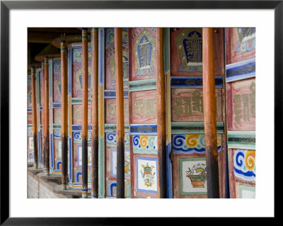 Prayer Wheels In A Row At A Buddhist Monastery In Qinhai, China by David Evans Pricing Limited Edition Print image