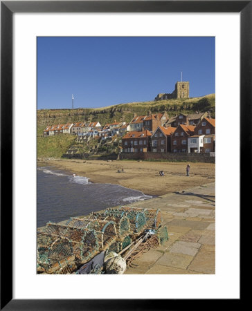 Whitby Church, Sandy Beach And Lobster Pots On Quayside, Whitby, Yorkshire, England by Neale Clarke Pricing Limited Edition Print image