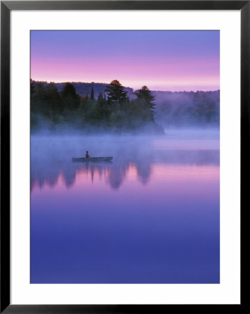 Canoeist On Lake At Sunrise, Algonquin Provincial Park, Ontario, Canada by Nancy Rotenberg Pricing Limited Edition Print image