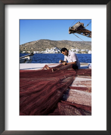 Fisherman Mending Nets On Quayside At Katapola, Island Of Amorgos, Cyclades, Greece by Richard Ashworth Pricing Limited Edition Print image