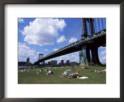 People Sunbathing At A Park In Brooklyn Under The Manhattan Bridge, New York, New York State, Usa by Yadid Levy Pricing Limited Edition Print image