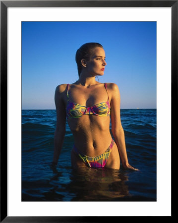 Young Woman Wearing Swimsuit On Beach In Water by David Marshall Pricing Limited Edition Print image