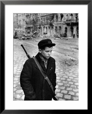 Boy Freedom Fighter Carrying Rifle During Hungarian Revolution Against Soviet Backed Government by Michael Rougier Pricing Limited Edition Print image