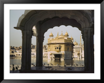 The Golden Temple Framed By The Arch Of A Small Pavilion by Maynard Owen Williams Pricing Limited Edition Print image