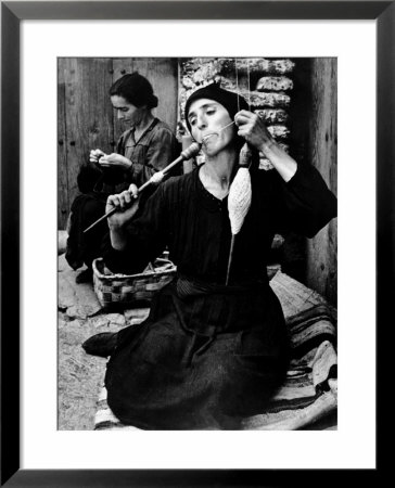 Spanish Peasant Using Ancient Methods To Spin Flax Into Thread by W. Eugene Smith Pricing Limited Edition Print image