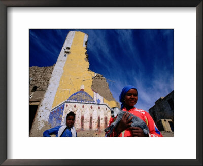 Woman Holding A Kid Goat At A Luxor Village, Luxor, Egypt by Izzet Keribar Pricing Limited Edition Print image
