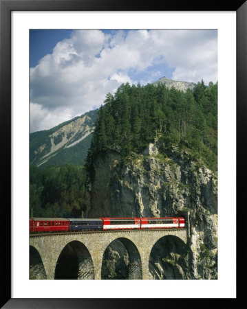 Train Passes Into A Tunnel In The Mountains Of Switzerland by Taylor S. Kennedy Pricing Limited Edition Print image