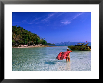 Woman With Red Sarong Enjoying Sea, Krabi, Thailand by Juliet Coombe Pricing Limited Edition Print image