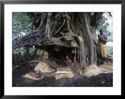 Woman And Children Of Kastom Village Selling Souvenirs Under Banyan Tree, Yakel, Vanuatu by Holger Leue Pricing Limited Edition Print image