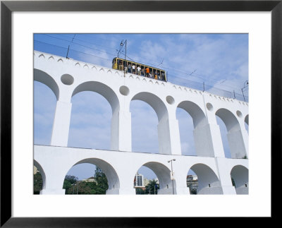 Santa Teresa Bondinho (Tram) Travelling Over A Bridge, Rio De Janeiro, Brazil, South America by Marco Simoni Pricing Limited Edition Print image