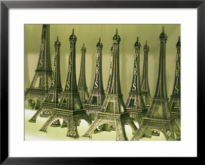 Display Of Miniature Eiffel Towers In Charles De Gaulle Airport Store by Todd Gipstein Pricing Limited Edition Print image