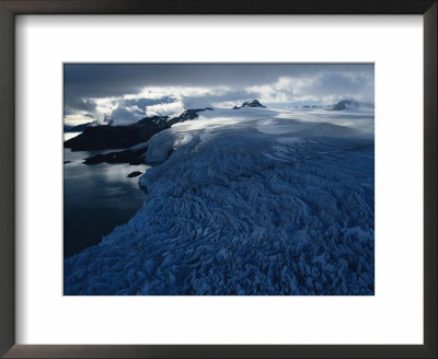 Severely Crevassed Glaciers Edge The Mountains On South Georgia Island by Maria Stenzel Pricing Limited Edition Print image
