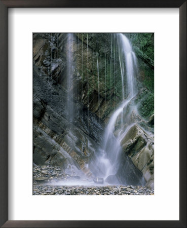 Waterfall With Wet Rocks And Pebbles Taken From Beach, Cornwall, England, United Kingdom by Roy Rainford Pricing Limited Edition Print image