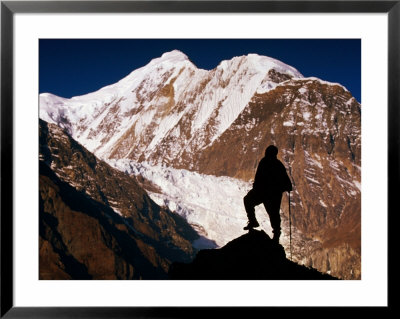 Lone Hiker Standing In Front Of Gangapurna, Annapurna Circuit, Manang, Nepal by Andrew Parkinson Pricing Limited Edition Print image