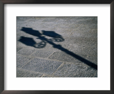 Lamp-Post Shadow Near Harbour Of Porta A Mare, Alghero, Sardinia, Italy by Martin Lladó Pricing Limited Edition Print image