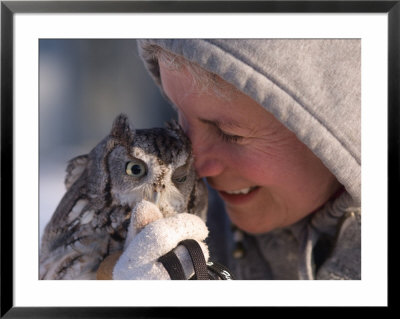 A Woman Holds An Endangered Eastern Screech Owl At A Recovery Center by Joel Sartore Pricing Limited Edition Print image