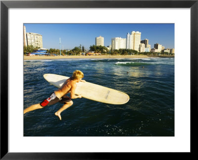 A Surfer Jumps Into The Sea With The Golden Mile In The Background, Kwazulu-Natal, South Africa by Roger De La Harpe Pricing Limited Edition Print image