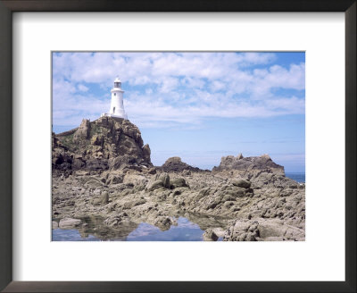 Lighthouse From The Causeway At Low Tide, Corbiere, St. Brelade, Jersey, Channel Islands by David Hunter Pricing Limited Edition Print image