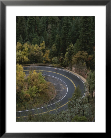 Aerial View Of A Runner On A Winding Road In Oak Creek Canyon by John Burcham Pricing Limited Edition Print image