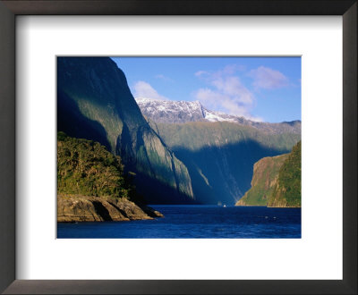 Boat In Distance Between Mountains, Milford Sound, New Zealand by Peter Hendrie Pricing Limited Edition Print image