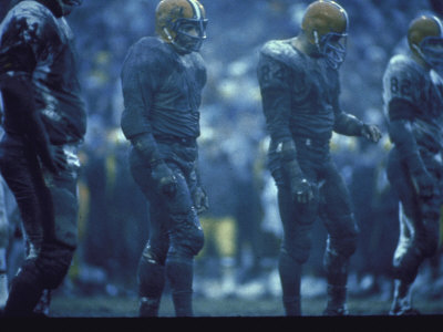 Cleveland Browns Awaiting Play In Game Against Green Bay Packers, Municipal Stadium,1965 by Art Rickerby Pricing Limited Edition Print image