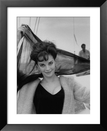 Portrait Of Actress Natalie Wood Aboard Boat, Holding Scarf Behind Her Head by Paul Schutzer Pricing Limited Edition Print image