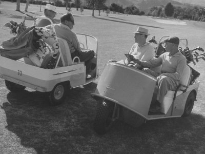 Jack Benny And Harpo Marx In Caddy Cars, Used At Palms Springs Golf Course by Leonard Mccombe Pricing Limited Edition Print image