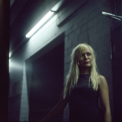 A Young Blonde Woman Standing In A Dark Alleyway by Jewgeni Roppel Pricing Limited Edition Print image