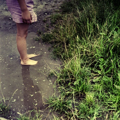 A Young Person Standing In A Puddle by Jewgeni Roppel Pricing Limited Edition Print image