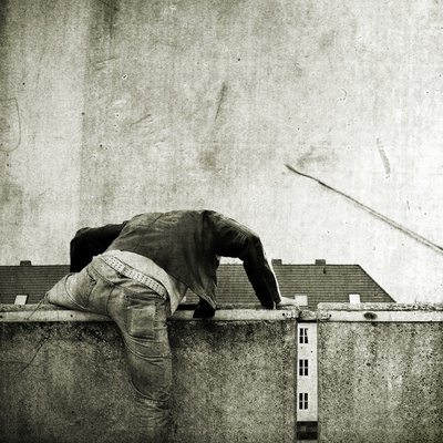 A Youth Climbing Over A Wall by Jewgeni Roppel Pricing Limited Edition Print image