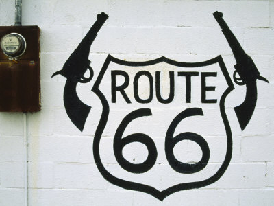 Old Route 66 Sign On An Abandoned Building Approaching Winslow by Stephen St. John Pricing Limited Edition Print image