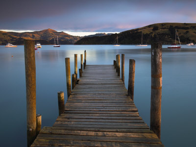 Early Morning Beside A Jetty Overlooking Akaroa Harbour, Banks Peninsula, South Island, New Zealand by Adam Burton Pricing Limited Edition Print image
