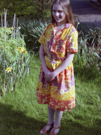 A Young Girl Wearing A 'Scooby Doo' Dress by Vanessa Wagstaff Pricing Limited Edition Print image