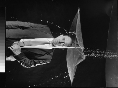 Harry Heavner Demonstrating Disposable Plastic Umbrella At International Gadget And Invention Show by Ralph Morse Pricing Limited Edition Print image