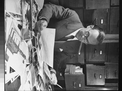 Industrial Designer Joseph Binder Researching In Picture Collection Of The New York Public Library by Alfred Eisenstaedt Pricing Limited Edition Print image