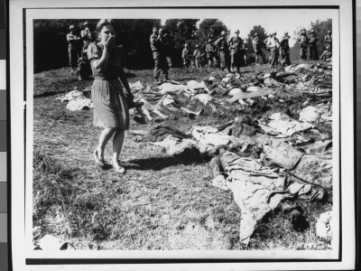 German Girl Is Overcome By Exhumed Bodies Of Some Of 800 Slave Workers Murdered By Ss Guards by Edward Belfer Pricing Limited Edition Print image