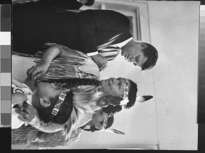 Senator John Kennedy Signing His Autograph On The Back Of A Menominee Indian Woman by Stan Wayman Pricing Limited Edition Print image