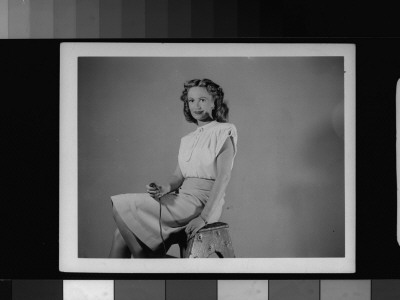 Actress Geraldine Fitzgerald Holding Shutter Release As She Takes Her Own Photograph by Gjon Mili Pricing Limited Edition Print image
