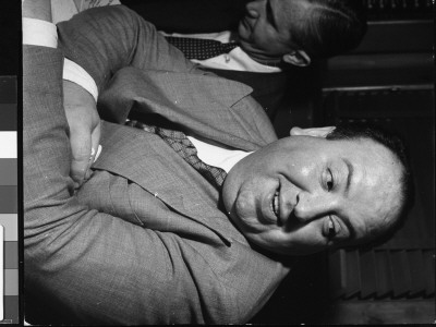 Movie Director Alfred Hitchcock Sitting At Chasen's Bar During Cocktail Hour by Peter Stackpole Pricing Limited Edition Print image