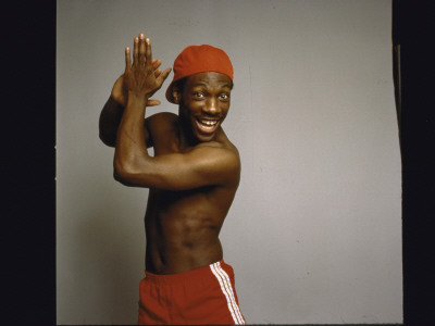 Comedian Eddie Murphy Clapping Hands, Wearing Only Baseball Cap And Shorts by Ted Thai Pricing Limited Edition Print image