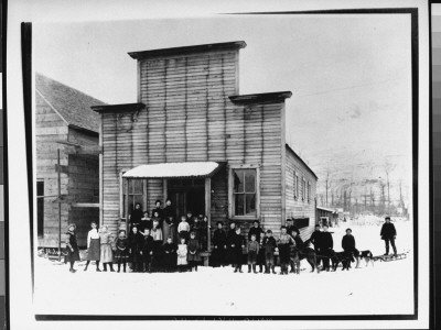 Children And Teachers Standing In Snow In Front Of Their Public School by Miles Brothers Pricing Limited Edition Print image