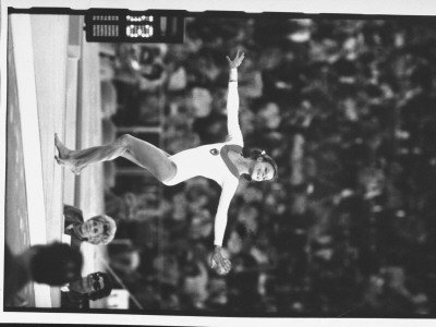 Russian Gymnast Olga Korbut Performing Floor Exercise During Olympic Games by John Dominis Pricing Limited Edition Print image