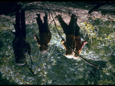 4 Children From Hippie Commune Walking Through Woods With Big Sticks by John Olson Pricing Limited Edition Print image