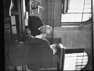 Man Being Assisted At Information Desk In The New York Public Library by Alfred Eisenstaedt Pricing Limited Edition Print image